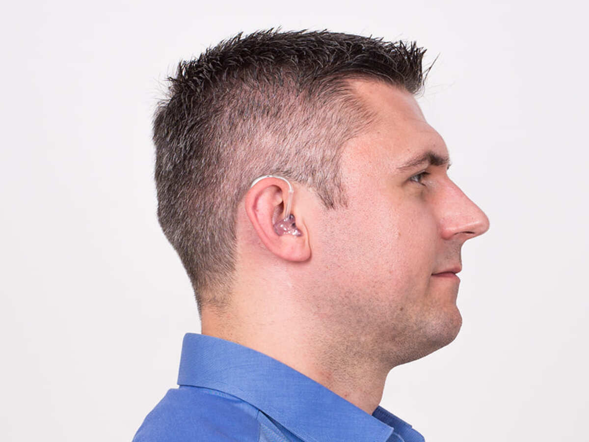 man wearing two hearing aids